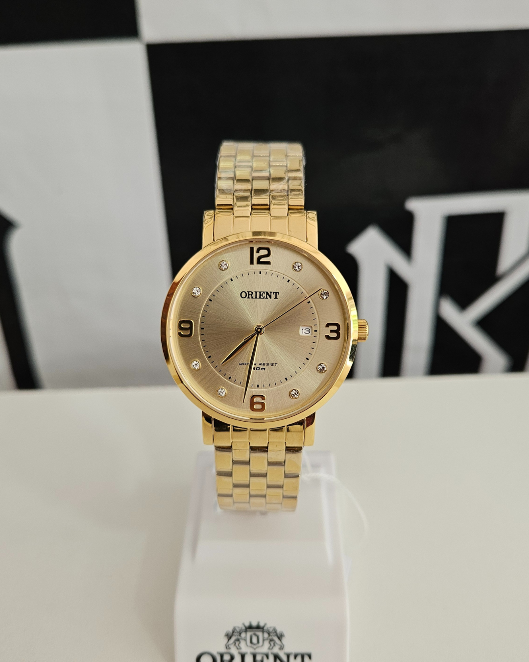 Relógio Feminino Orient Dourado com Mostrador Champanhe – 38 mm